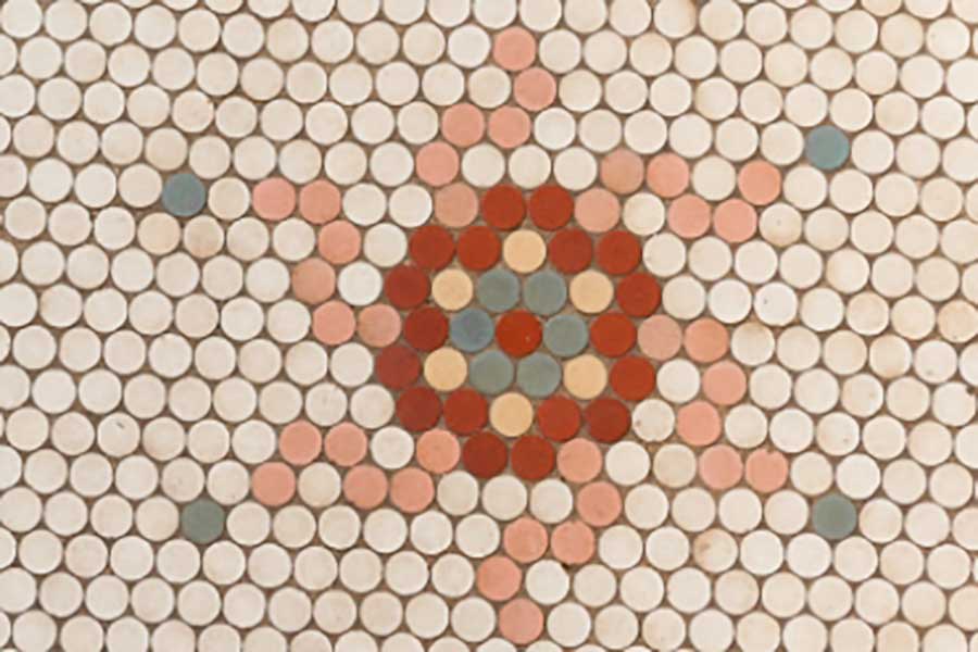 Detail of original hand-laid penny tile
