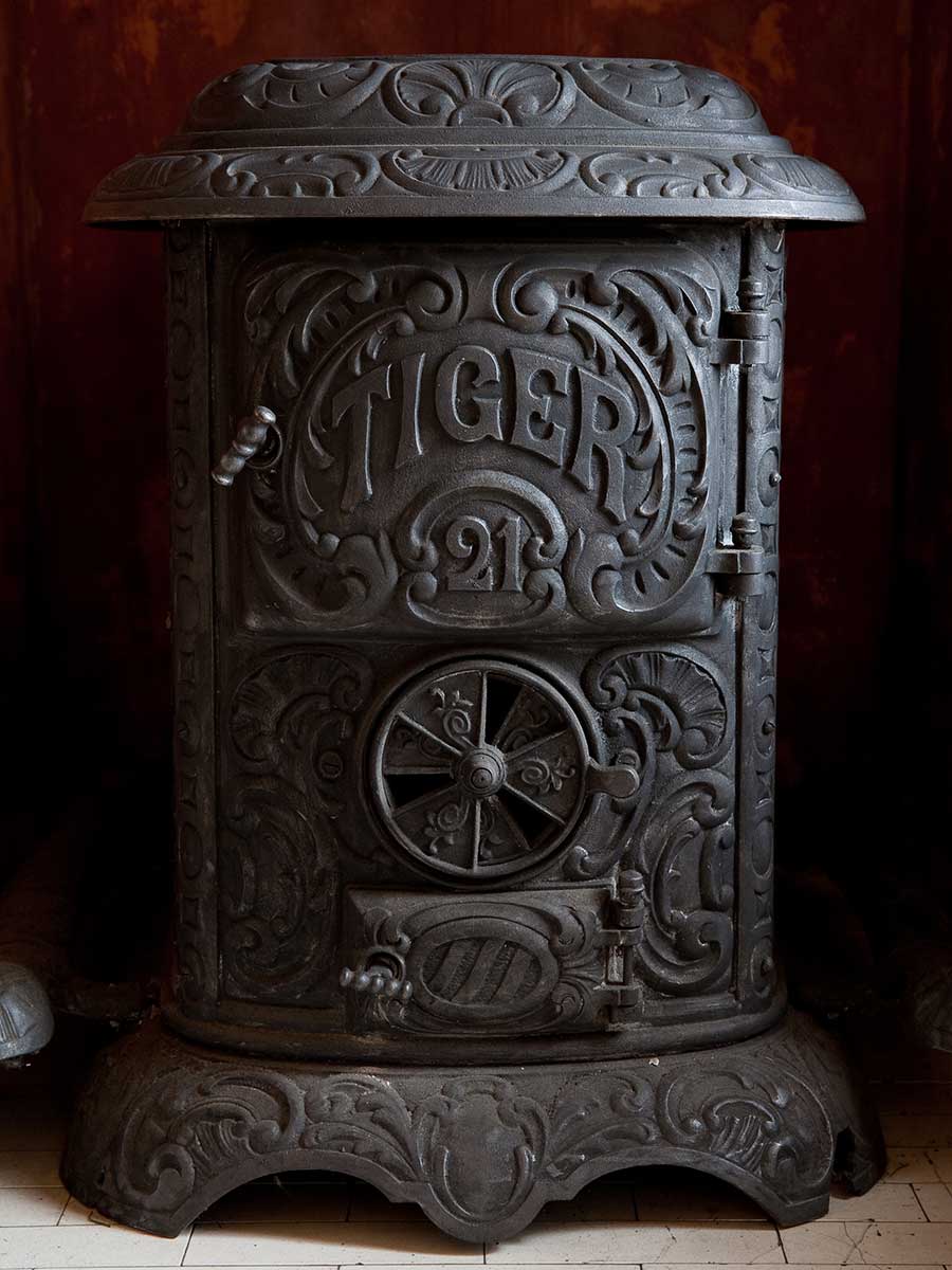 Cast iron "Franklin" stove, one of many used to heat the home